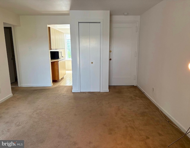922 W Montgomery Ave Unit C-1, Ardmore, PA 19003 - unfurnished bedroom with light carpet and a closet