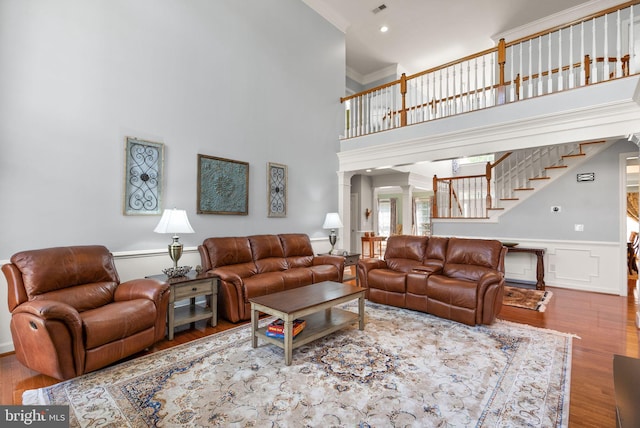 14512 Penderlea Ct, Gainesville, VA 20155 - living area with ornate columns, wood finished floors, stairway, wainscoting, and a high ceiling