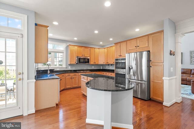 14512 Penderlea Ct, Gainesville, VA 20155 - kitchen with appliances with stainless steel finishes, light wood-style floors, a kitchen island, recessed lighting, and dark stone countertops
