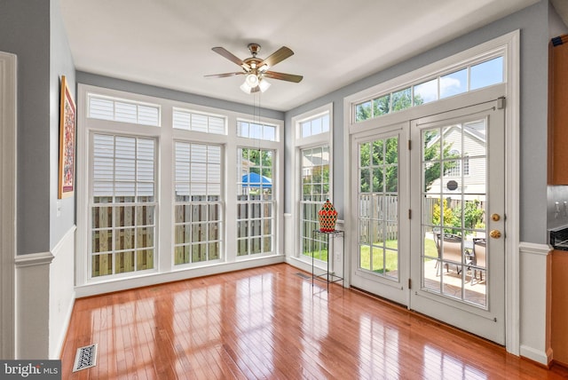 14512 Penderlea Ct, Gainesville, VA 20155 - unfurnished sunroom with french doors, wood-type flooring, and a wainscoted wall