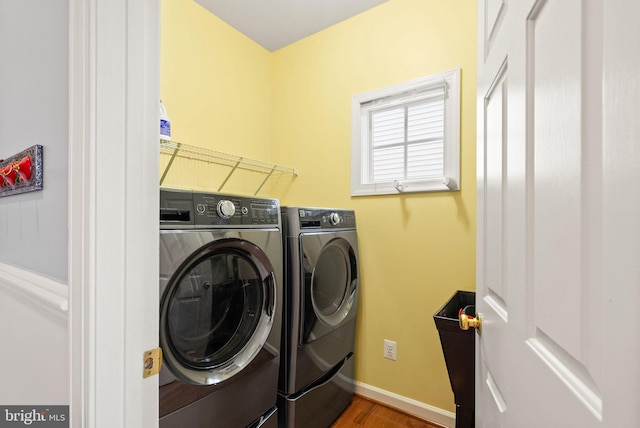 14512 Penderlea Ct, Gainesville, VA 20155 - laundry area featuring washing machine and dryer and wood finished floors