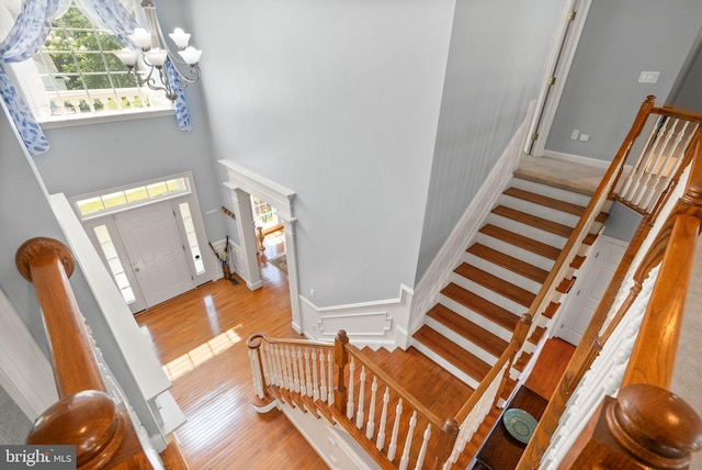 14512 Penderlea Ct, Gainesville, VA 20155 - foyer with wood finished floors, stairs, a chandelier, and a high ceiling