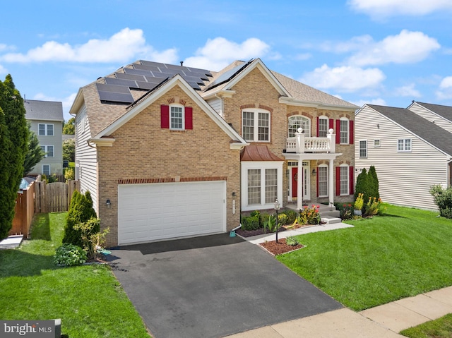 14512 Penderlea Ct, Gainesville, VA 20155 - colonial house featuring brick siding, driveway, a garage, and a balcony