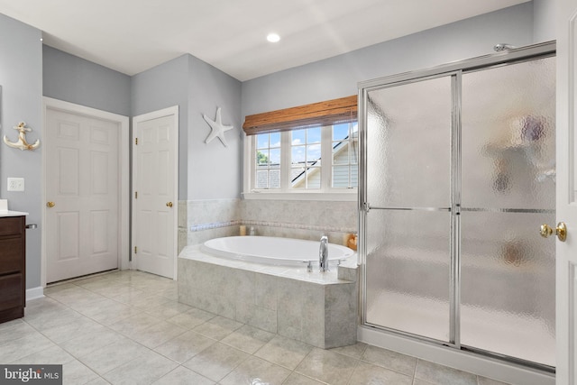 14512 Penderlea Ct, Gainesville, VA 20155 - full bathroom featuring vanity, a bath, tile patterned flooring, and a stall shower
