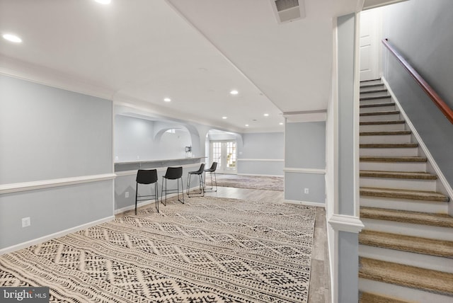 14512 Penderlea Ct, Gainesville, VA 20155 - interior space featuring wet bar, recessed lighting, ornamental molding, and arched walkways