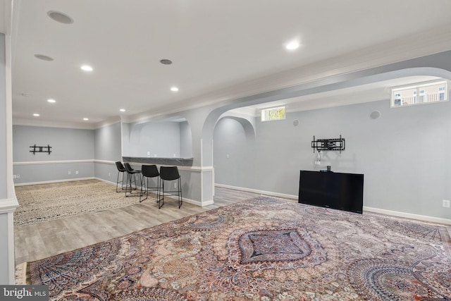 14512 Penderlea Ct, Gainesville, VA 20155 - indoor bar with wood finished floors, ornamental molding, recessed lighting, and arched walkways