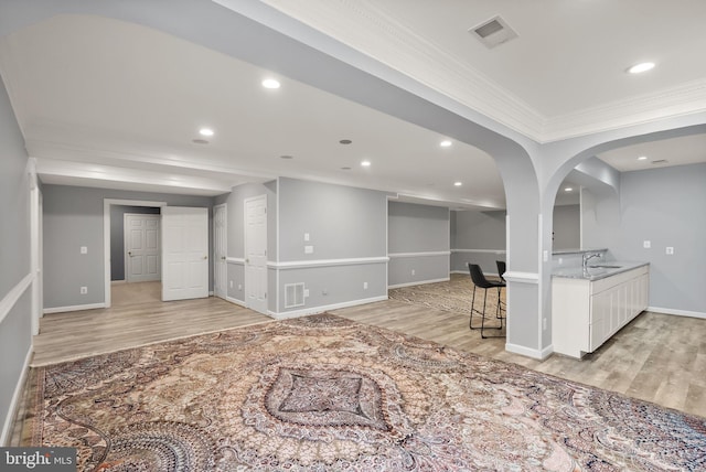 14512 Penderlea Ct, Gainesville, VA 20155 - living area with ornamental molding, light wood-style floors, recessed lighting, and arched walkways