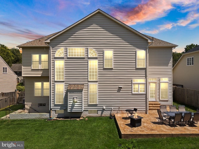 14512 Penderlea Ct, Gainesville, VA 20155 - back of property at dusk with entry steps, a fenced backyard, a patio area, and a shingled roof