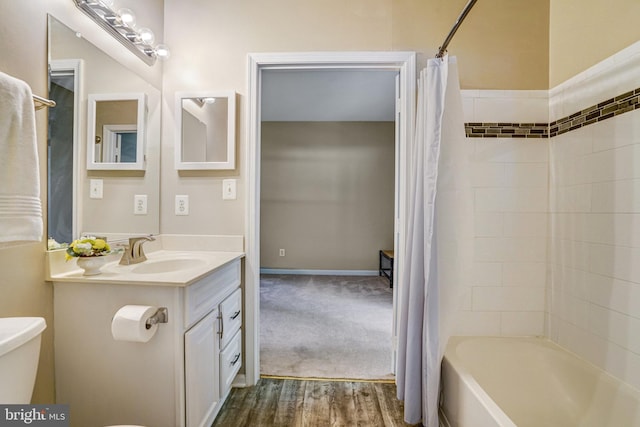 6532 Grange Ln Unit 103, Alexandria, VA 22315 - full bath featuring vanity, shower / bathtub combination with curtain, and wood finished floors