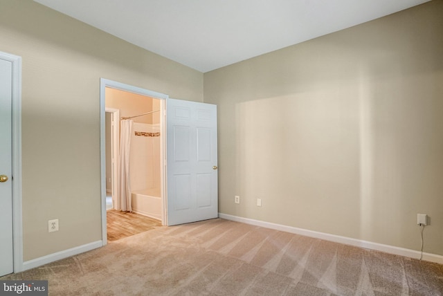 6532 Grange Ln Unit 103, Alexandria, VA 22315 - unfurnished bedroom featuring light colored carpet and ensuite bathroom