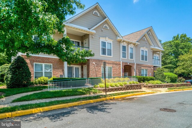 6532 Grange Ln Unit 103, Alexandria, VA 22315 - view of property featuring brick siding and a balcony