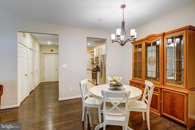 6532 Grange Ln Unit 103, Alexandria, VA 22315 - dining room featuring a chandelier and dark wood finished floors