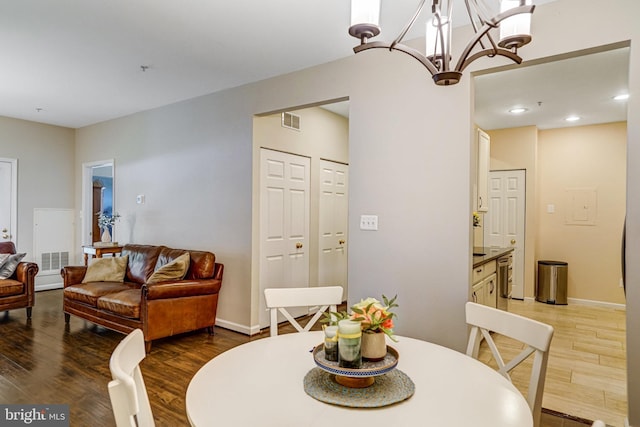 6532 Grange Ln Unit 103, Alexandria, VA 22315 - dining room featuring wood finished floors, a chandelier, and recessed lighting