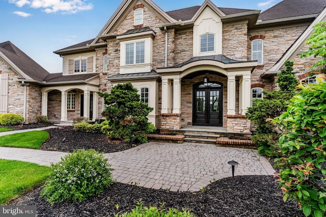 2740 Allen Glen Dr, Mechanicsburg, PA 17055 - view of front facade featuring stone siding, a porch, and french doors