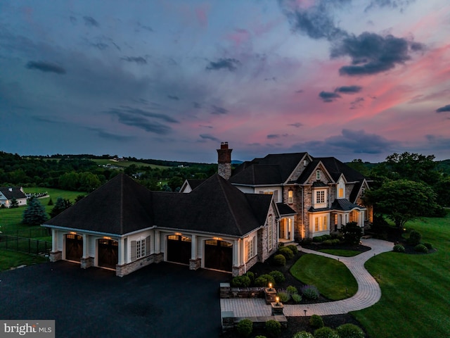 2740 Allen Glen Dr, Mechanicsburg, PA 17055 - view of front facade featuring stone siding, a garage, a chimney, and driveway