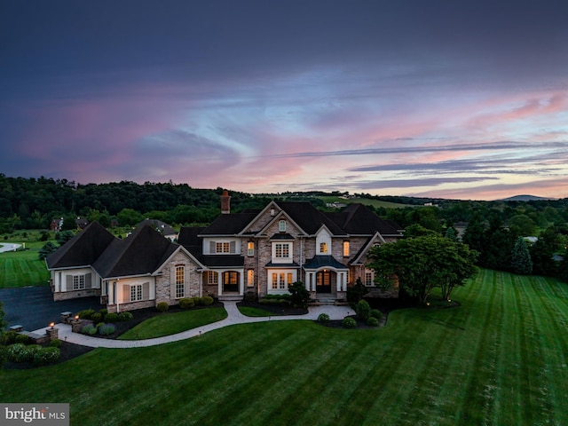 2740 Allen Glen Dr, Mechanicsburg, PA 17055 - view of front of home with stone siding, a chimney, and a yard