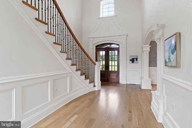 2740 Allen Glen Dr, Mechanicsburg, PA 17055 - foyer featuring a decorative wall, healthy amount of natural light, a towering ceiling, stairs, and light wood-style flooring