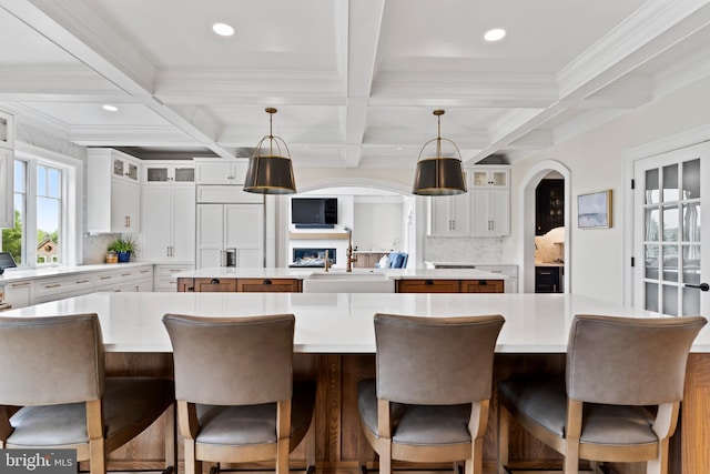 2740 Allen Glen Dr, Mechanicsburg, PA 17055 - kitchen with a kitchen island, decorative backsplash, beam ceiling, coffered ceiling, and white cabinets