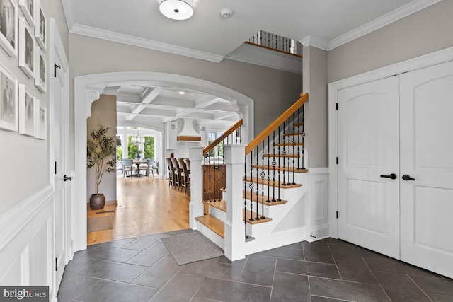 2740 Allen Glen Dr, Mechanicsburg, PA 17055 - foyer entrance featuring coffered ceiling, arched walkways, crown molding, stairway, and beam ceiling