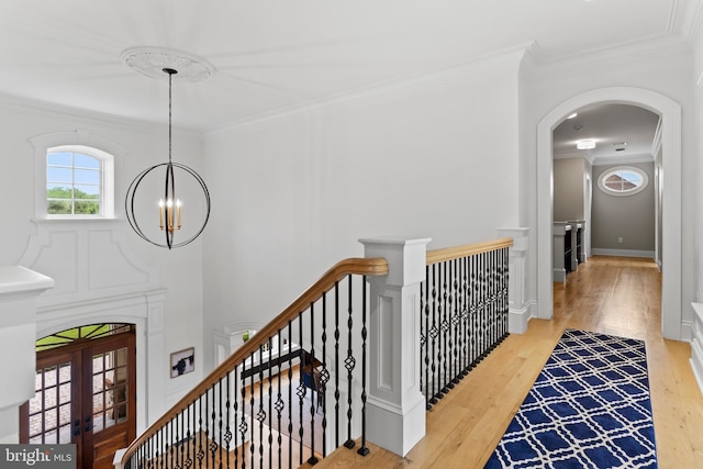 2740 Allen Glen Dr, Mechanicsburg, PA 17055 - hall with an upstairs landing, crown molding, a chandelier, wood finished floors, and arched walkways