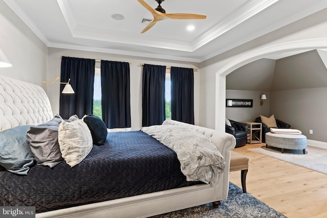 2740 Allen Glen Dr, Mechanicsburg, PA 17055 - bedroom featuring a raised ceiling, wood finished floors, ornamental molding, arched walkways, and a ceiling fan