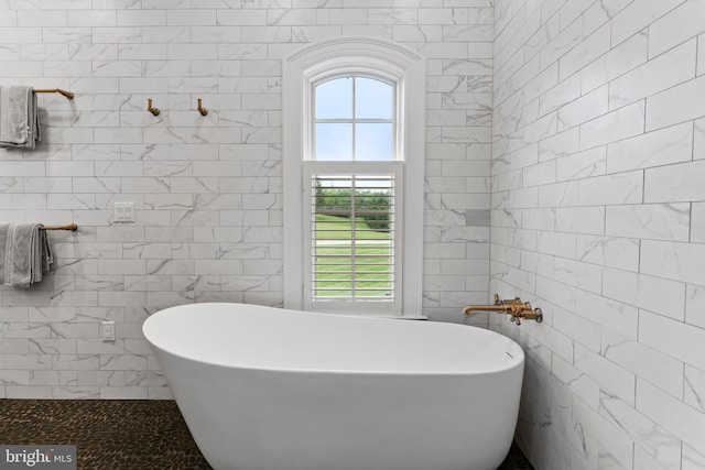 2740 Allen Glen Dr, Mechanicsburg, PA 17055 - bathroom featuring tile walls and a freestanding bath