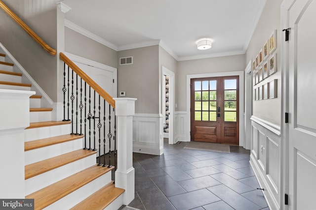 2740 Allen Glen Dr, Mechanicsburg, PA 17055 - foyer entrance with crown molding, stairs, a decorative wall, wainscoting, and dark tile patterned floors