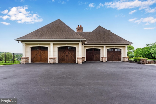 2740 Allen Glen Dr, Mechanicsburg, PA 17055 - view of side of home featuring a chimney, a shingled roof, and stone siding