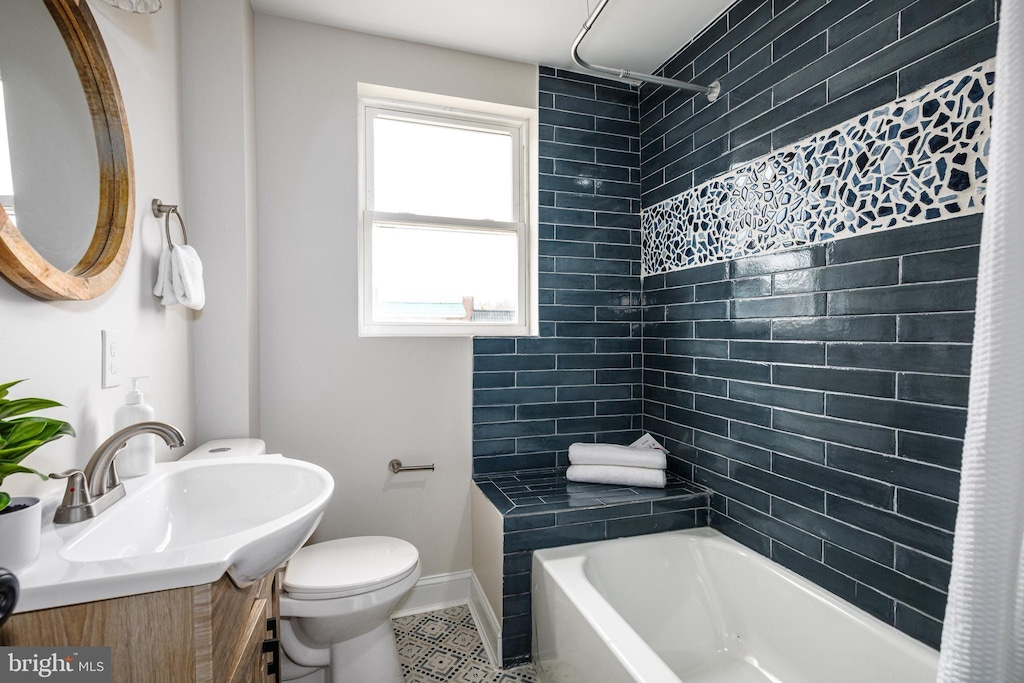 3717 Falls Rd, Baltimore, MD 21211 - bathroom featuring vanity, tile patterned floors, and shower / washtub combination