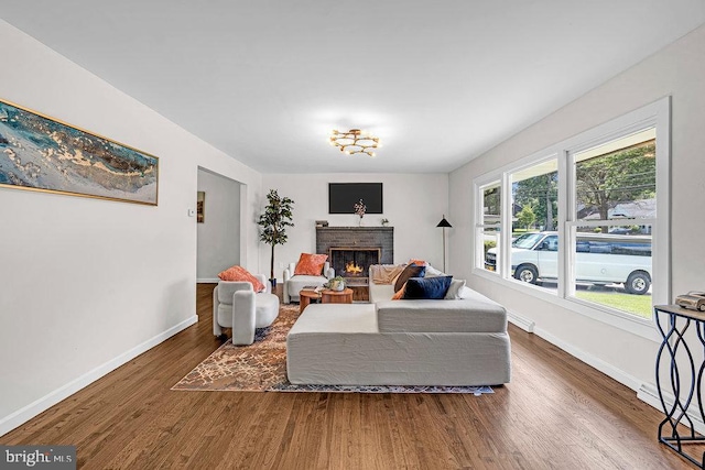 1528 Stuyvesant Ave, Trenton, NJ 08618 - living area featuring wood finished floors and a brick fireplace