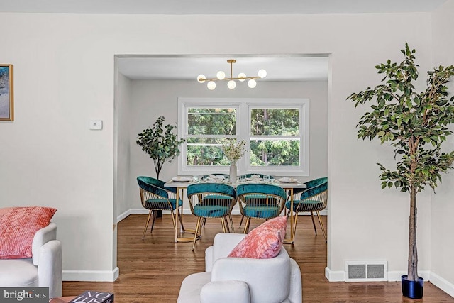 1528 Stuyvesant Ave, Trenton, NJ 08618 - dining room featuring wood finished floors and a chandelier