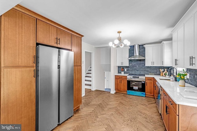1528 Stuyvesant Ave, Trenton, NJ 08618 - kitchen with appliances with stainless steel finishes, wall chimney exhaust hood, light countertops, decorative backsplash, and white cabinetry
