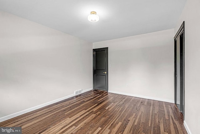 1528 Stuyvesant Ave, Trenton, NJ 08618 - empty room featuring dark wood-style flooring and baseboards