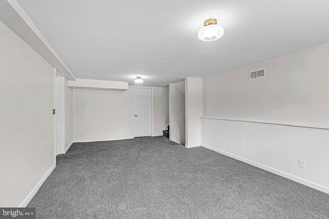 1528 Stuyvesant Ave, Trenton, NJ 08618 - finished basement with carpet flooring, stairway, and a wainscoted wall