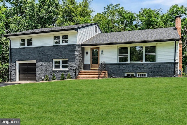1528 Stuyvesant Ave, Trenton, NJ 08618 - split level home with stone siding, a garage, a front yard, and asphalt driveway