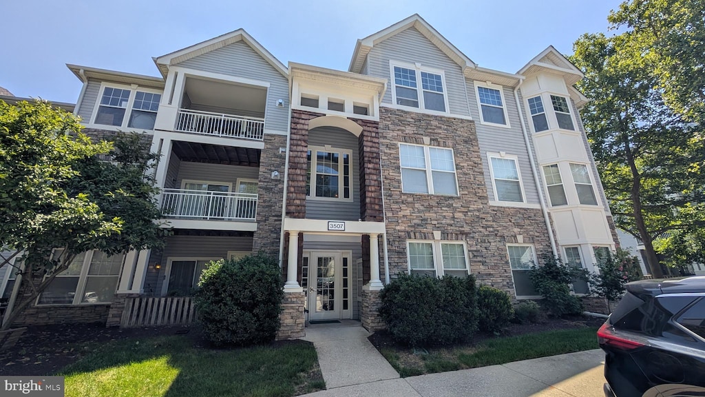 3507 Piney Woods Pl Unit B203, Laurel, MD 20724 - multi unit property with stone siding and a balcony
