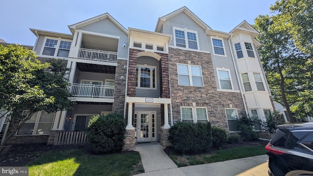 3507 Piney Woods Pl Unit B203, Laurel, MD 20724 - multi unit property with stone siding and a balcony