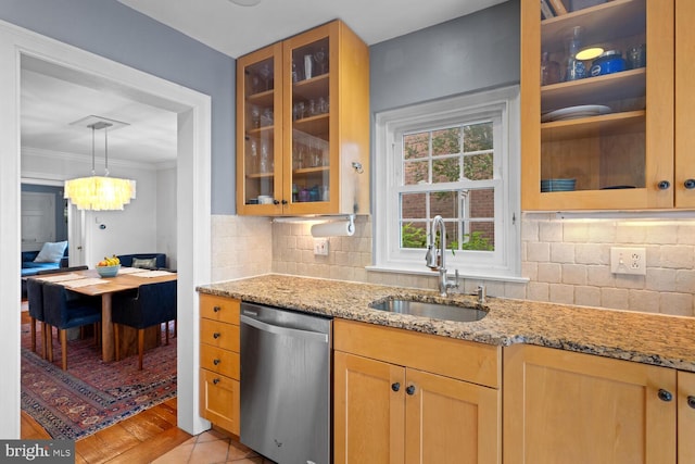 16 E Abington Ave, Philadelphia, PA 19118 - kitchen with stainless steel dishwasher, light stone counters, backsplash, glass insert cabinets, and crown molding