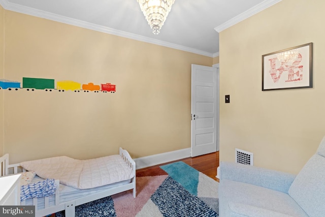 16 E Abington Ave, Philadelphia, PA 19118 - bedroom featuring ornamental molding and a chandelier