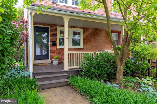 16 E Abington Ave, Philadelphia, PA 19118 - entrance to property featuring brick siding and covered porch