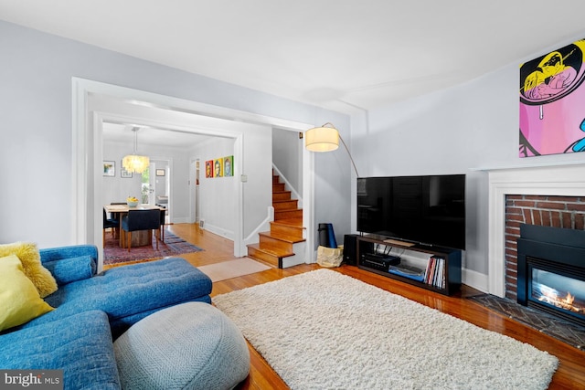 16 E Abington Ave, Philadelphia, PA 19118 - living area with stairway, wood finished floors, and a fireplace