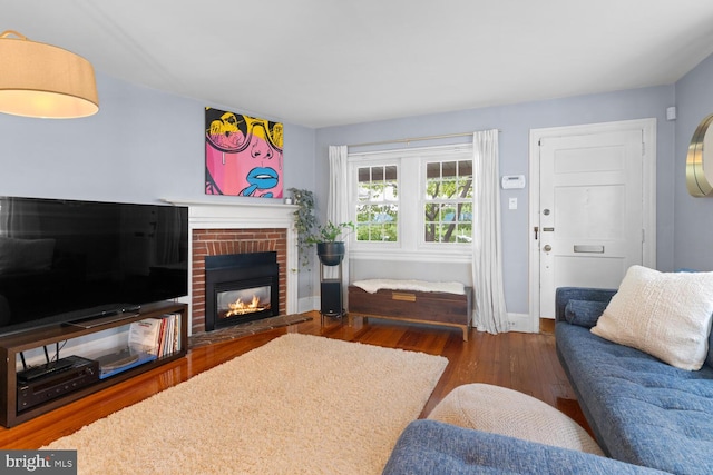 16 E Abington Ave, Philadelphia, PA 19118 - living area with wood finished floors and a brick fireplace