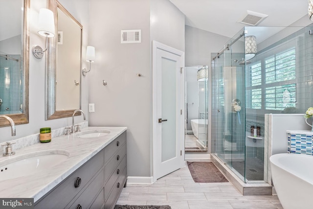 47643 Rhyolite Pl, Sterling, VA 20165 - bathroom featuring double vanity, a soaking tub, and a shower stall