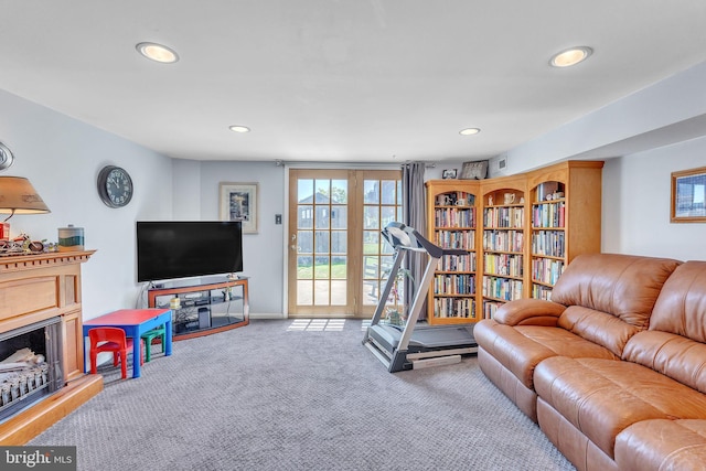 8905 Dewees St, Philadelphia, PA 19152 - carpeted living area with recessed lighting and a fireplace with raised hearth