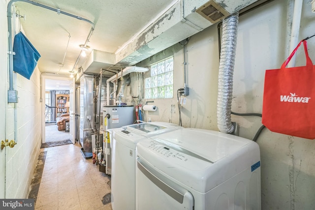 8905 Dewees St, Philadelphia, PA 19152 - washroom with gas water heater, independent washer and dryer, and tile patterned floors