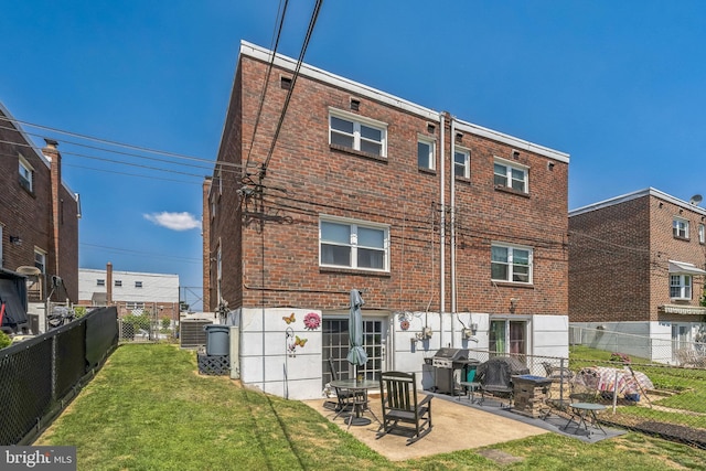 8905 Dewees St, Philadelphia, PA 19152 - back of house featuring a patio and brick siding