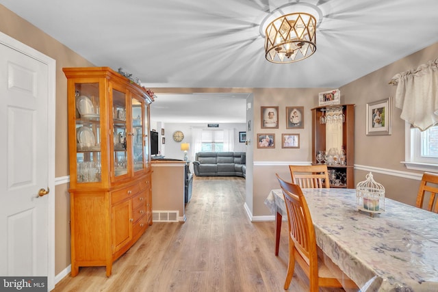 8905 Dewees St, Philadelphia, PA 19152 - dining room featuring light wood-style floors and a chandelier