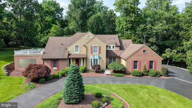 14 Quail Ridge Dr, Reading, PA 19607 - view of front facade with brick siding, a front lawn, and a shingled roof