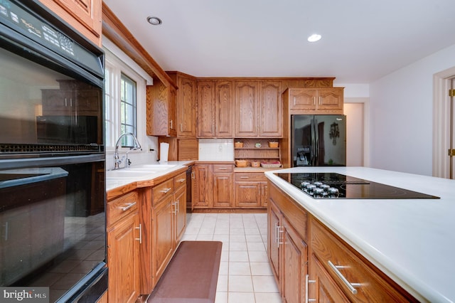 14 Quail Ridge Dr, Reading, PA 19607 - kitchen with black appliances, light countertops, brown cabinets, light tile patterned floors, and recessed lighting