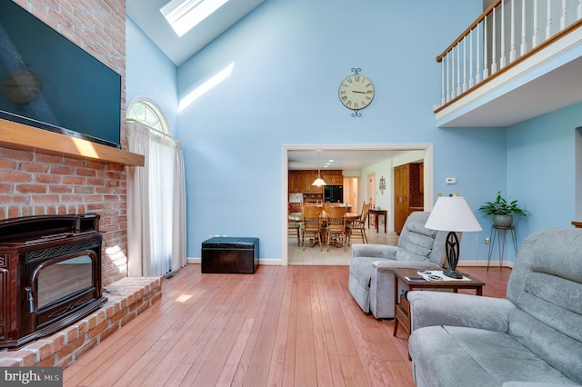 14 Quail Ridge Dr, Reading, PA 19607 - living room with high vaulted ceiling, a skylight, and wood-type flooring